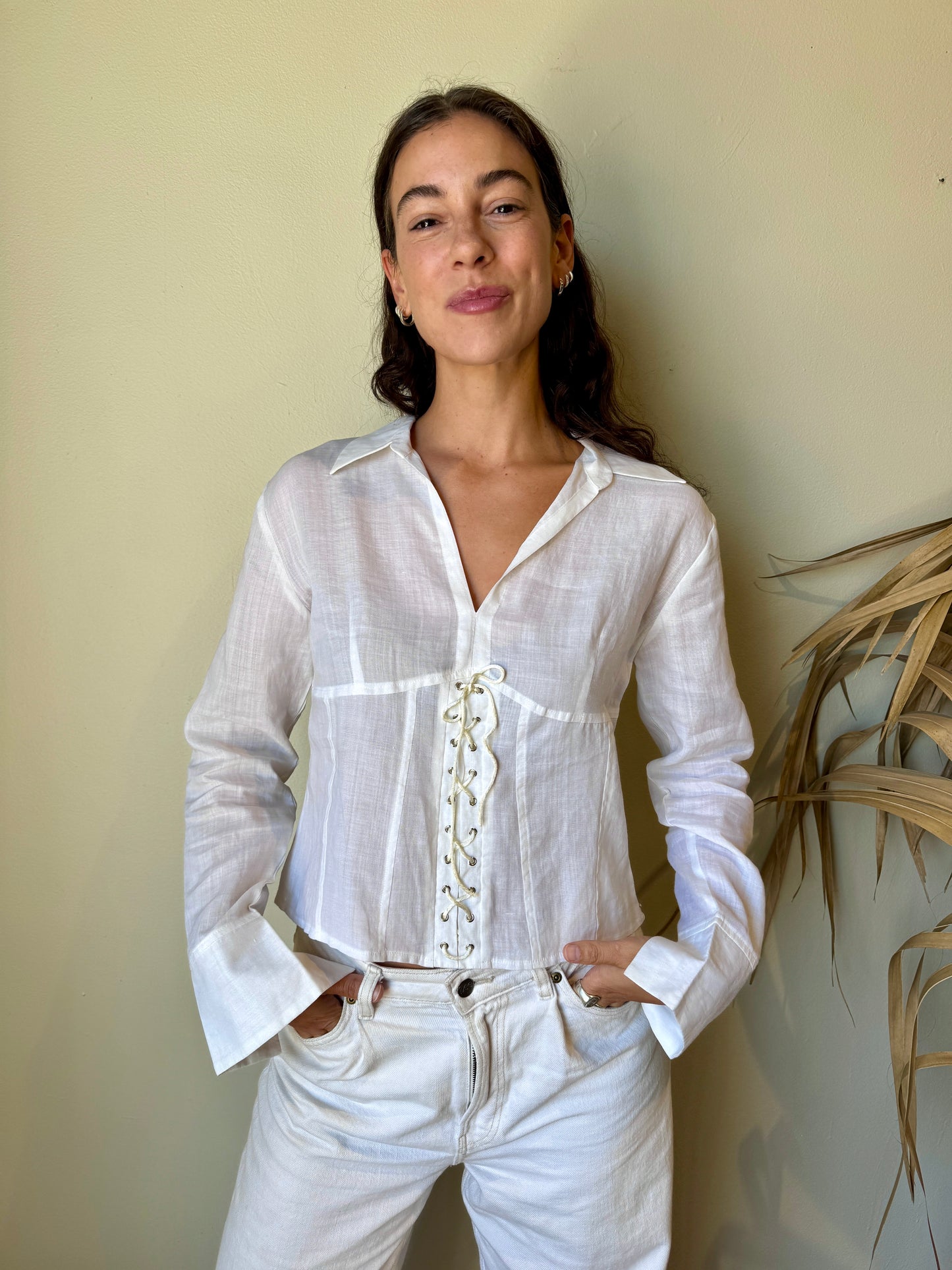 model in white linen corset blouse