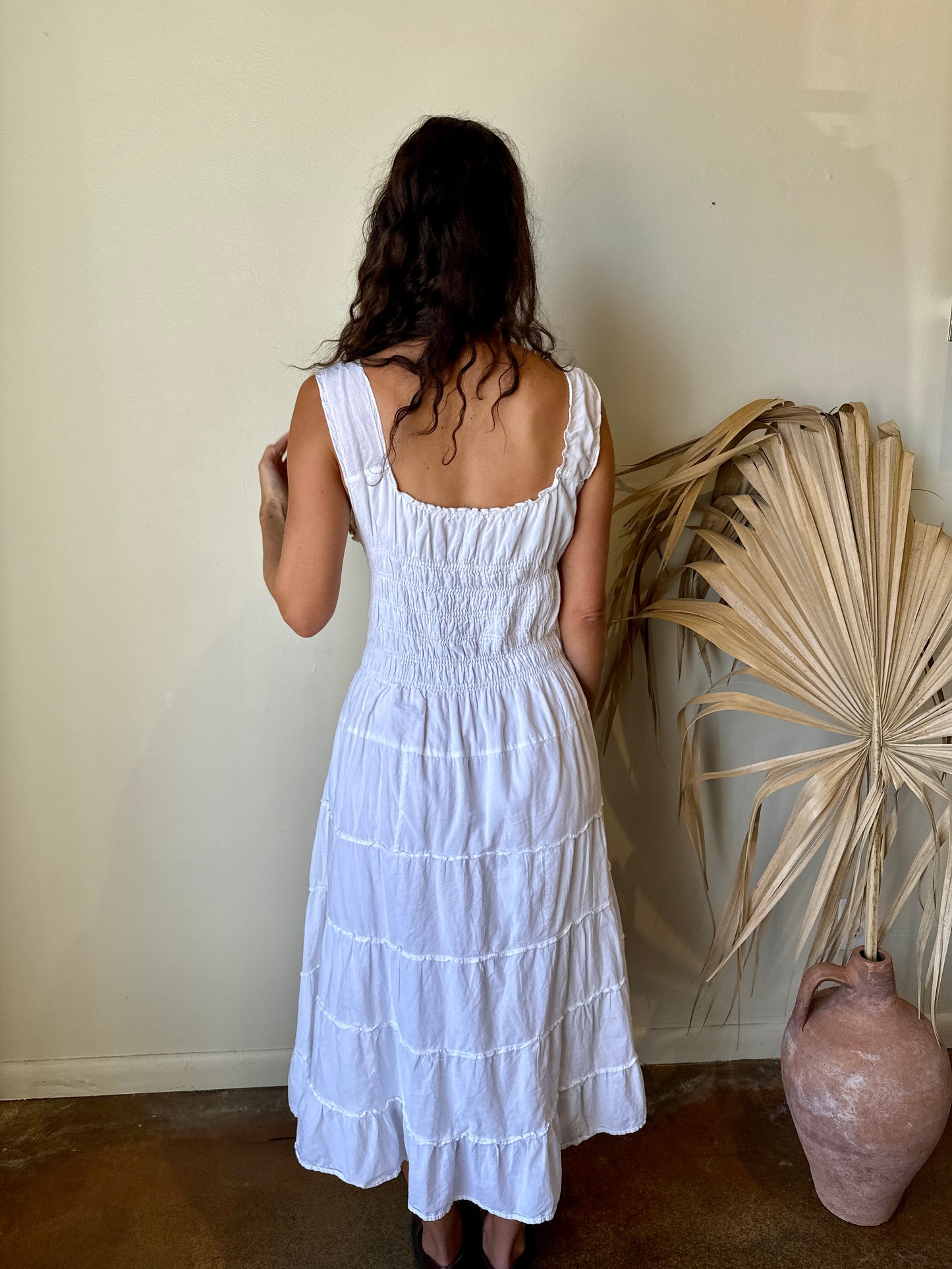 back modeled white smocked peasant maxi dress