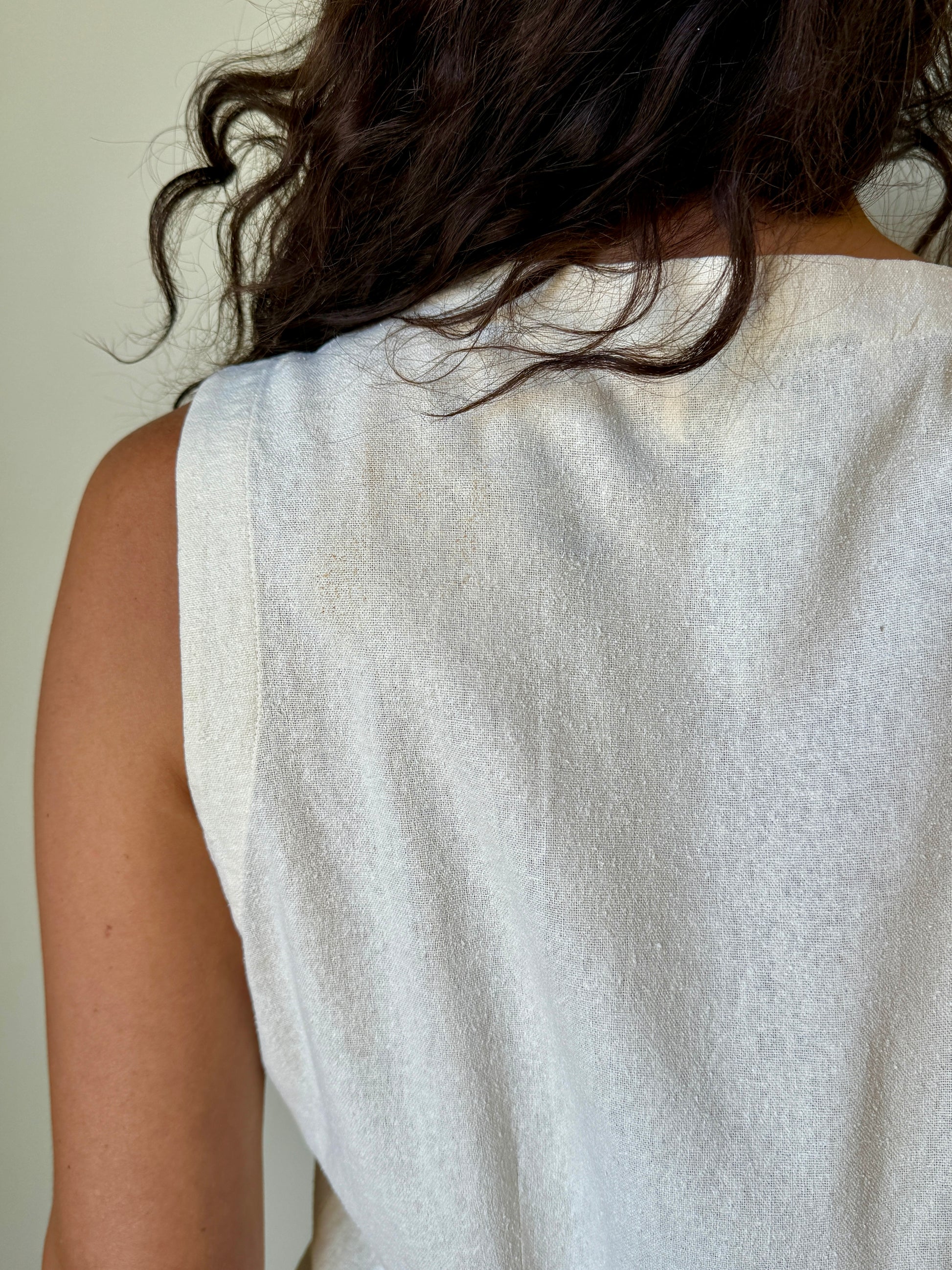 close up back silk embroidered ivory vest